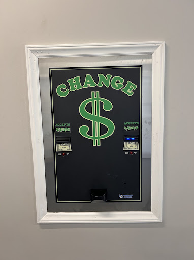 Wall-mounted change machine accepting $1–$20 bills